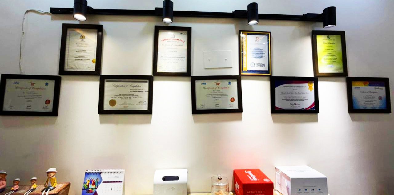 Certifications and continuing-education awards on the wall at Bright Care Dental Clinic