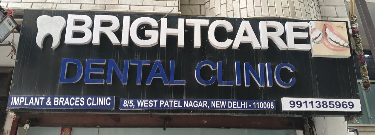 Bright Care Dental Clinic signboard — Implant & Braces Clinic, 8/5 West Patel Nagar, New Delhi 110008